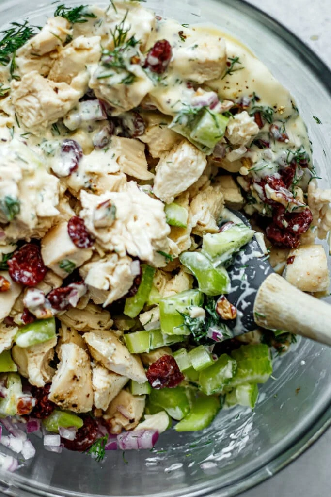 chicken salad with in a bowl with spatula