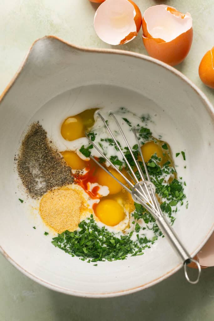 egg mixture in mixing bowl with whisk