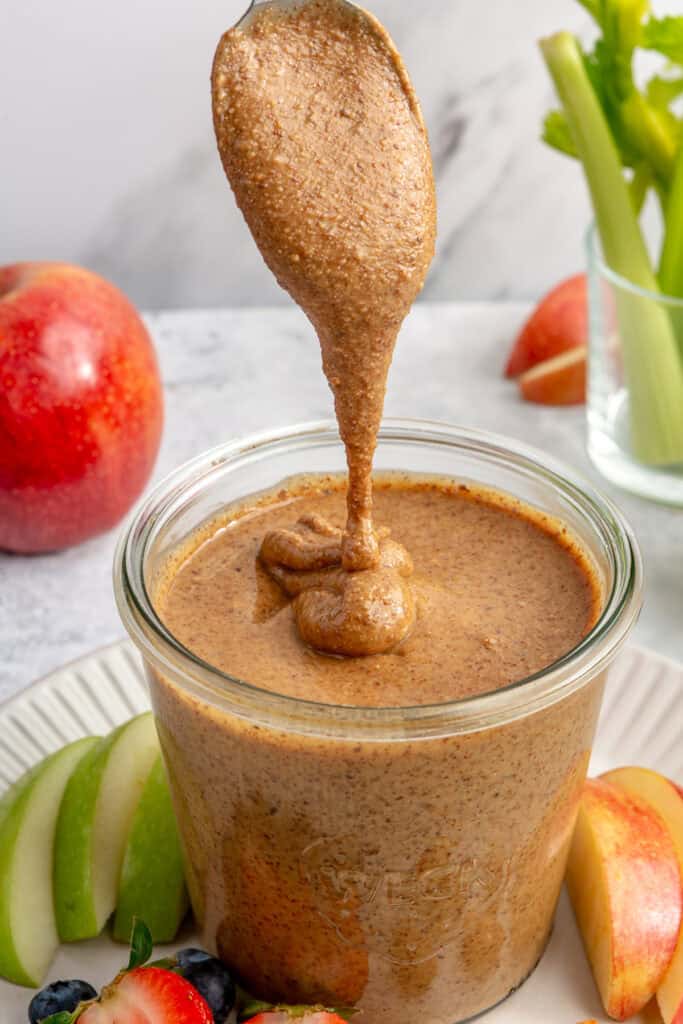 almond butter in jar with spoon