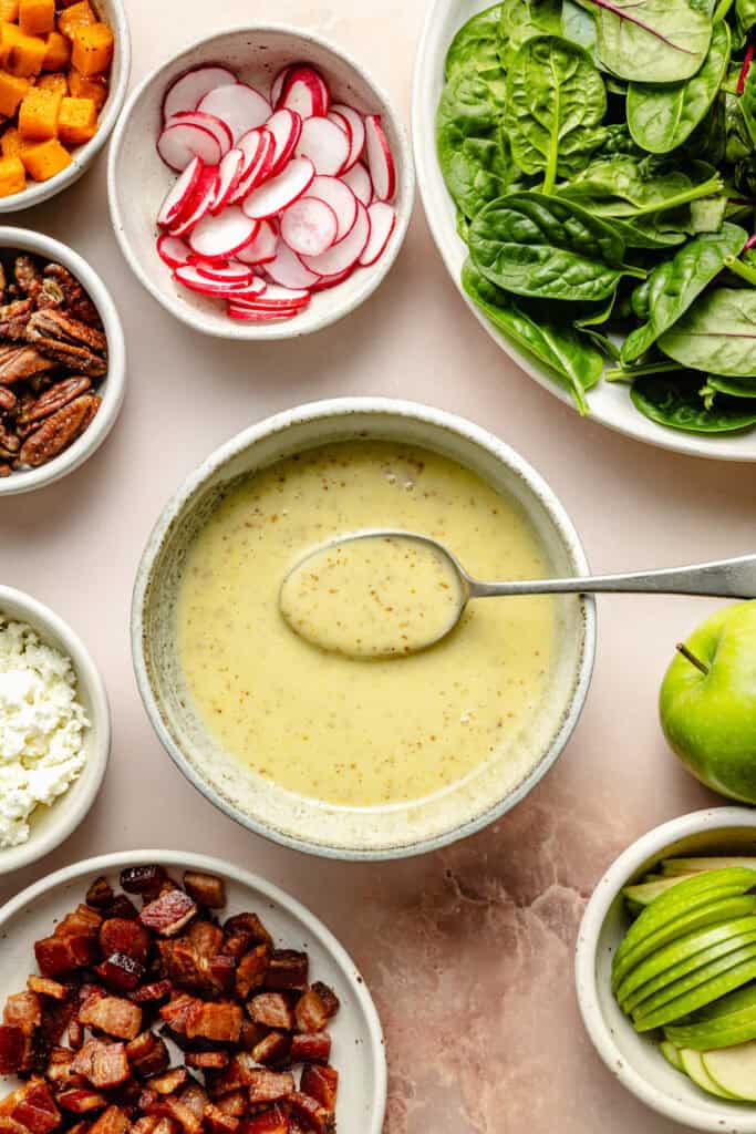 maple mustard vinaigrette in bowl with spoon