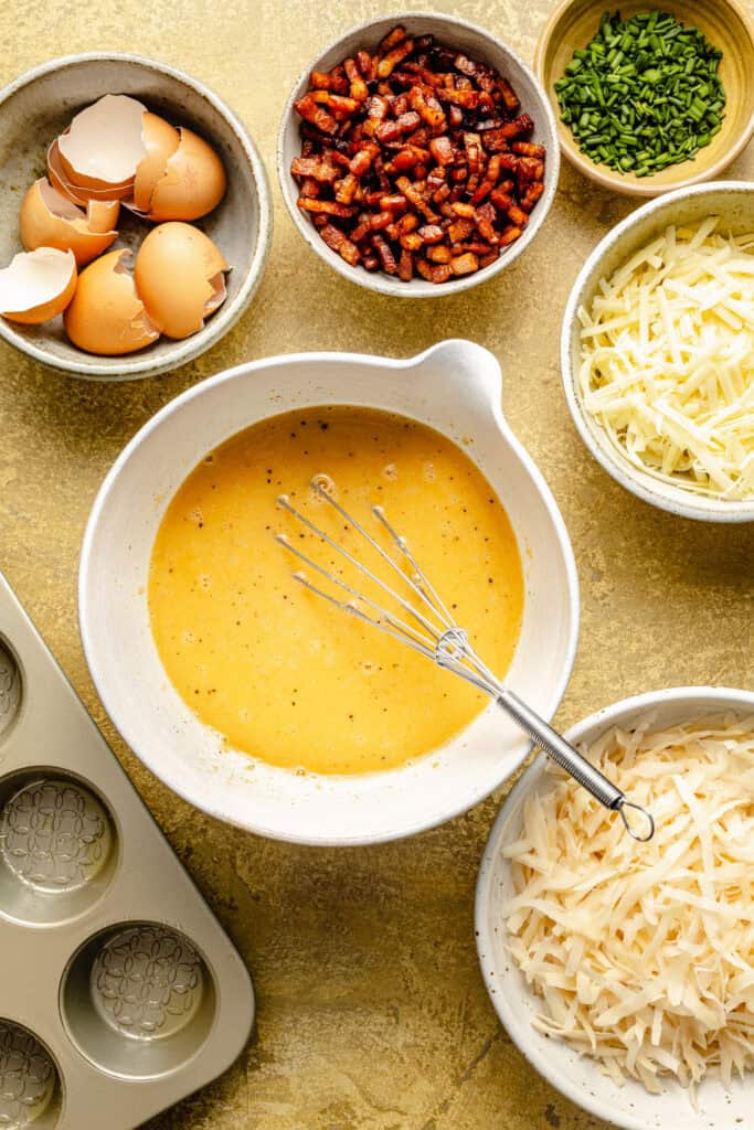 egg mixture in mixing bowl with whisk