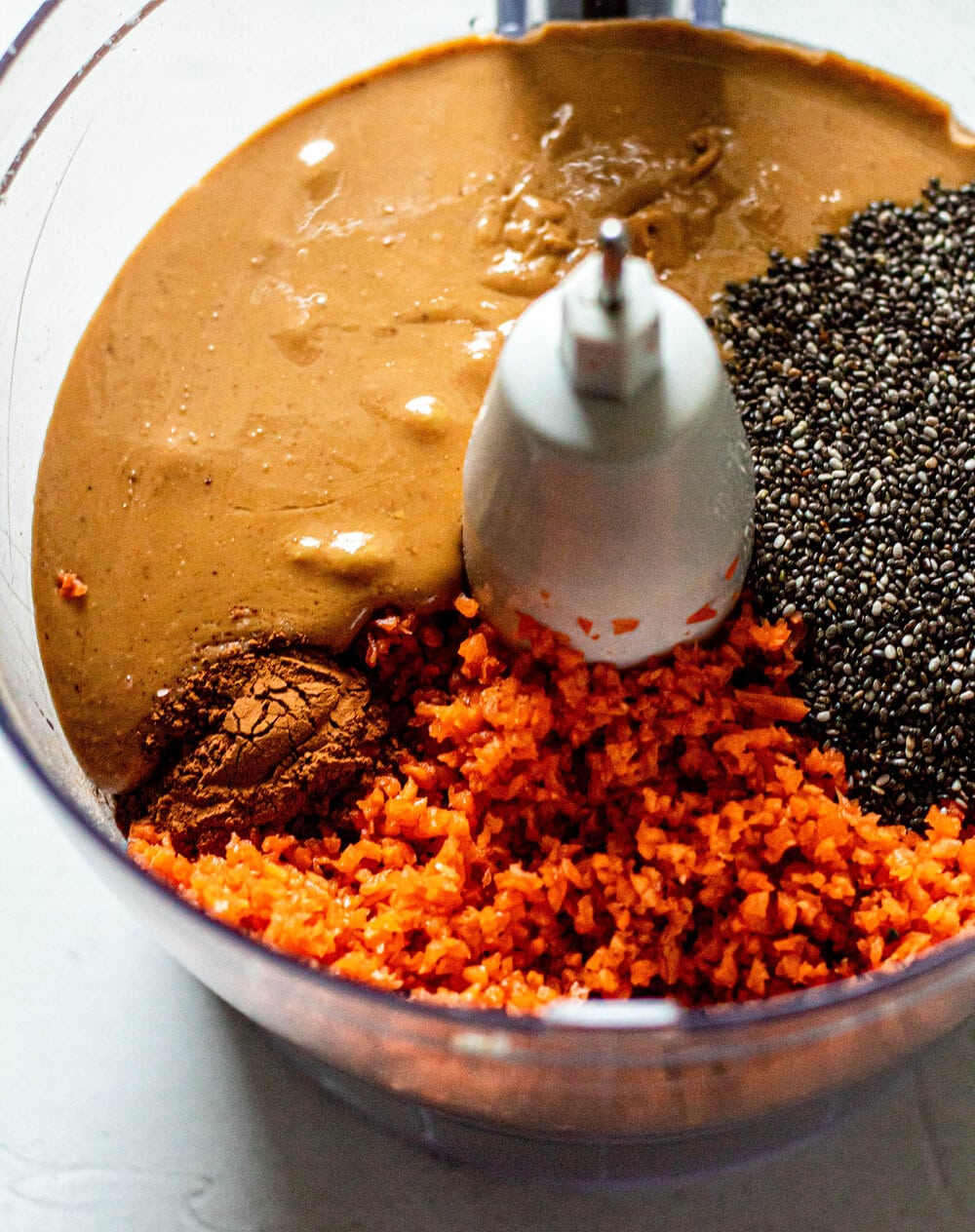 cashew butter, grated carrot, cinnamon, and chia seed in food processor