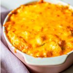 cauliflower Mac and cheese in a pink baking dish