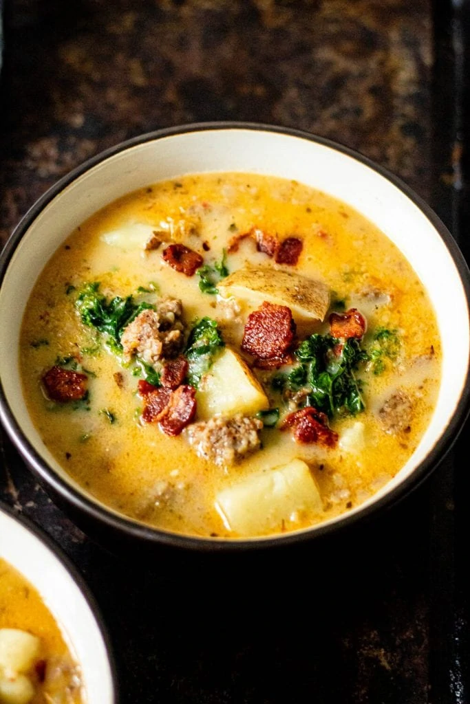 soup in a bowl topped with bacon