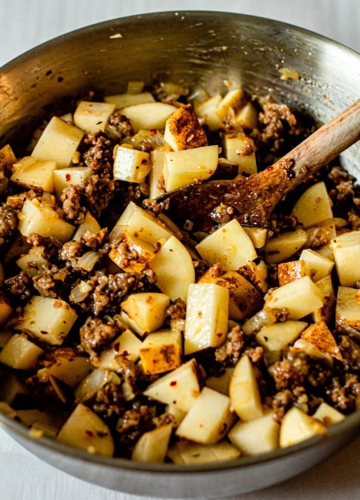 sausage and potatoes in pot