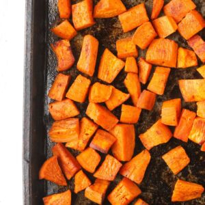 roasted sweet potatoes on a sheet pan