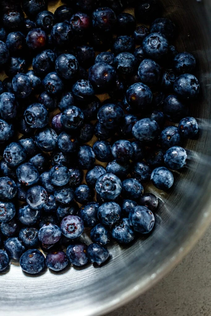 fresh blueberries in silver skillet