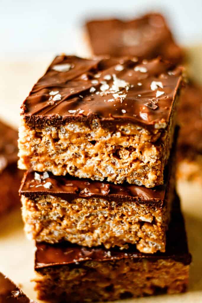 three peanut butter rice crispy treats stacked on each other