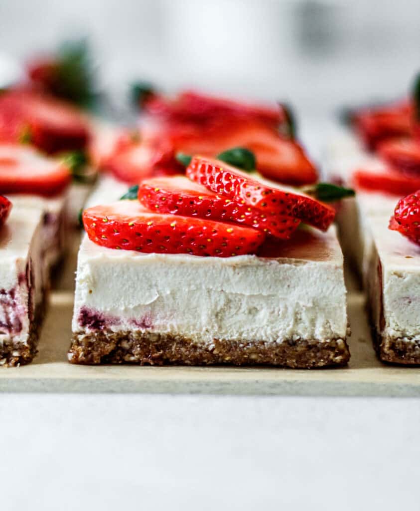 strawberry cheesecake bar topped with strawberries