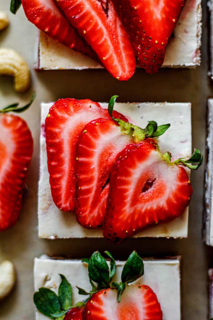 strawberry cheesecake bar topped with fresh strawberries