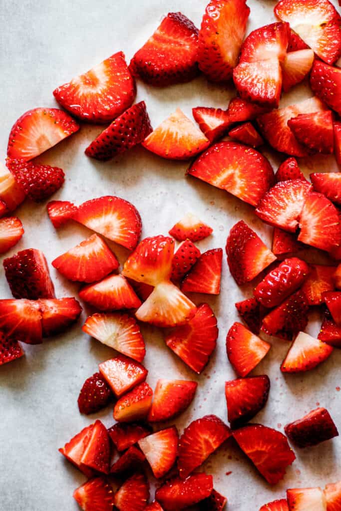 chopped strawberries on sheet pan