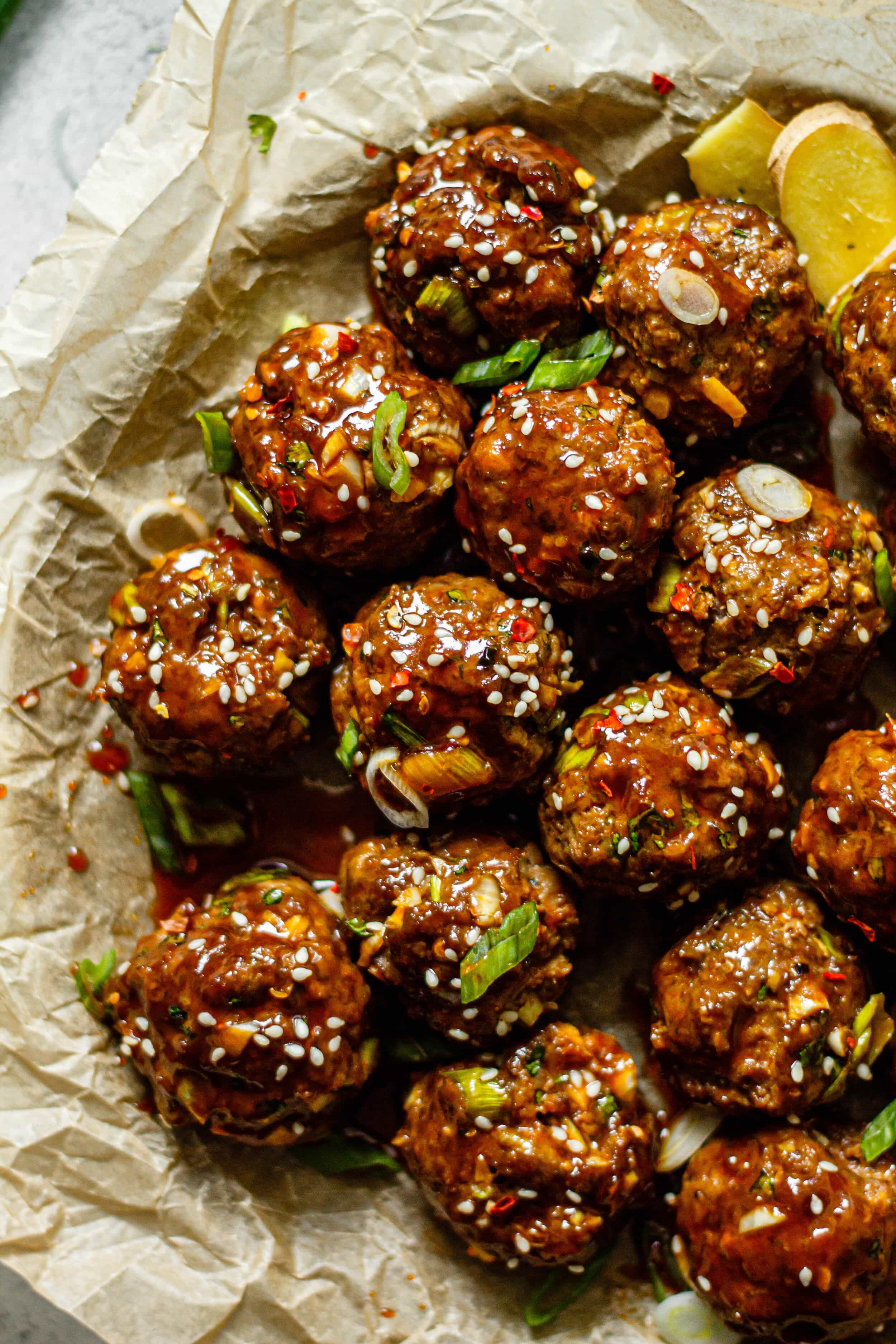ginger scallion meatballs on brown parchment