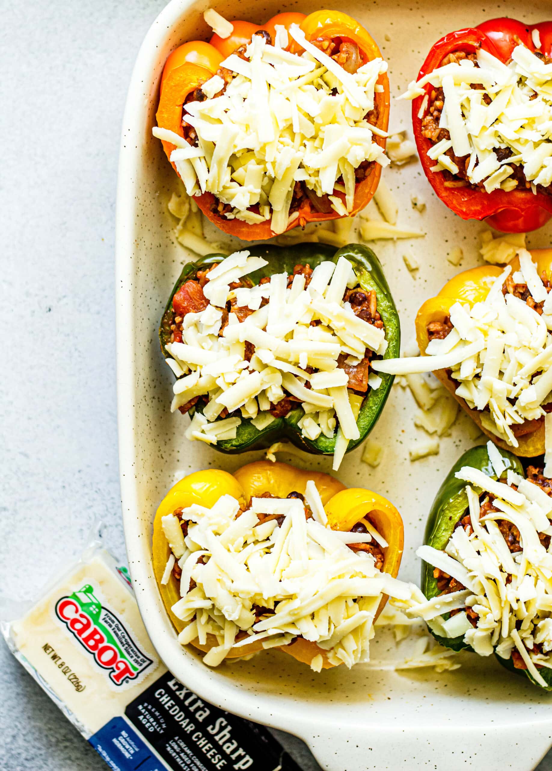 stuffed peppers topped with shredded cheese