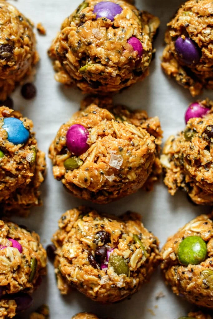 monster cookie energy bites scooped out onto parchment paper