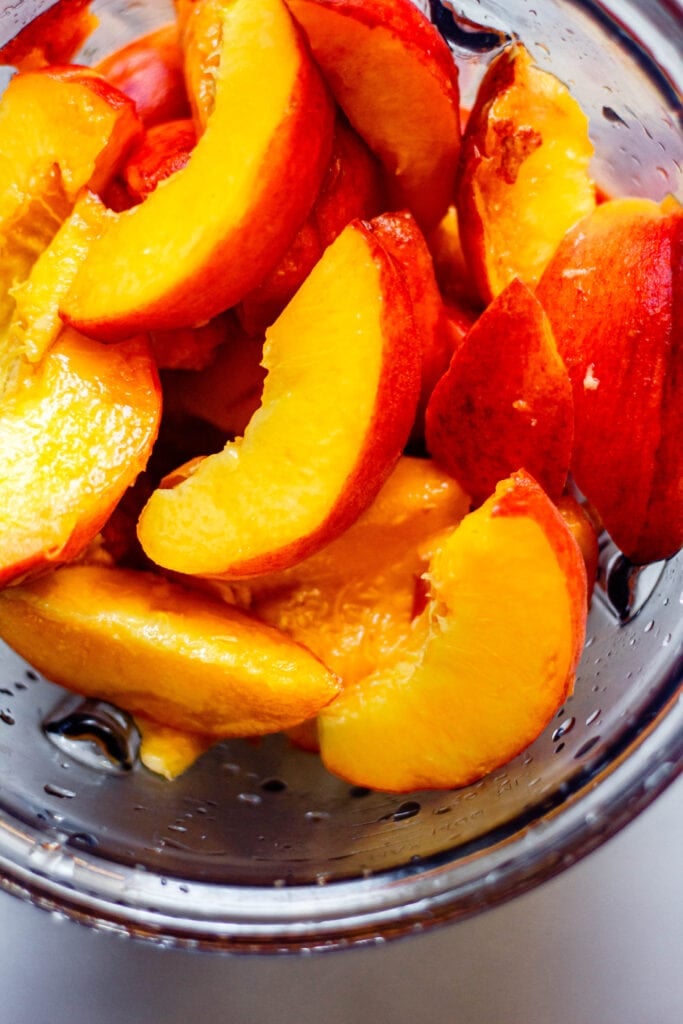 sliced peaches in a blender