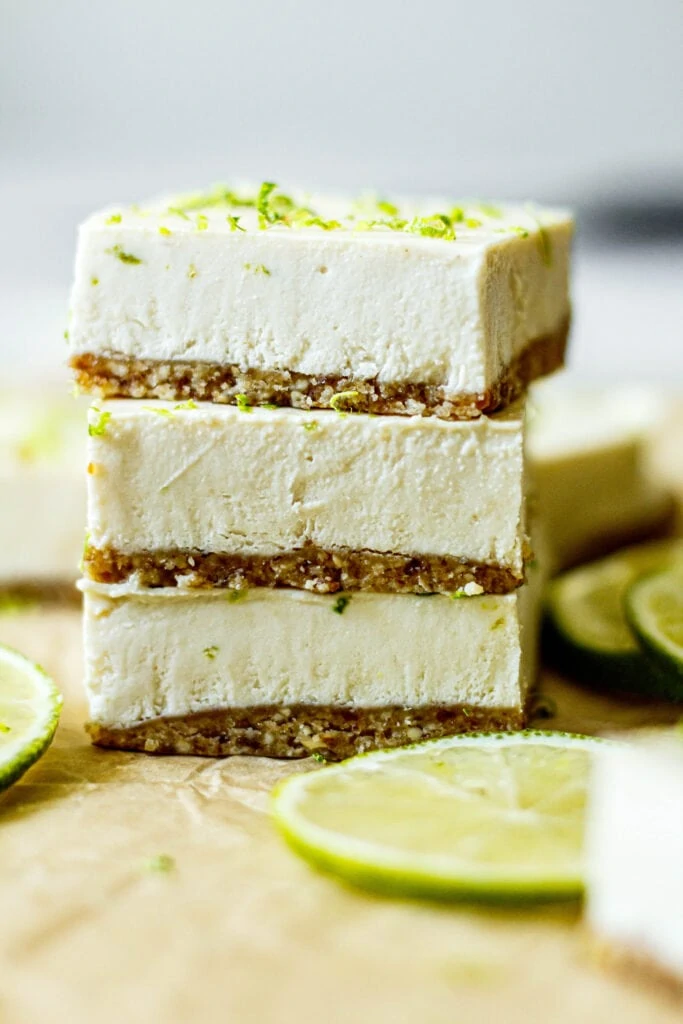 Healthy Key Lime Pie Bars stacked on top of each other