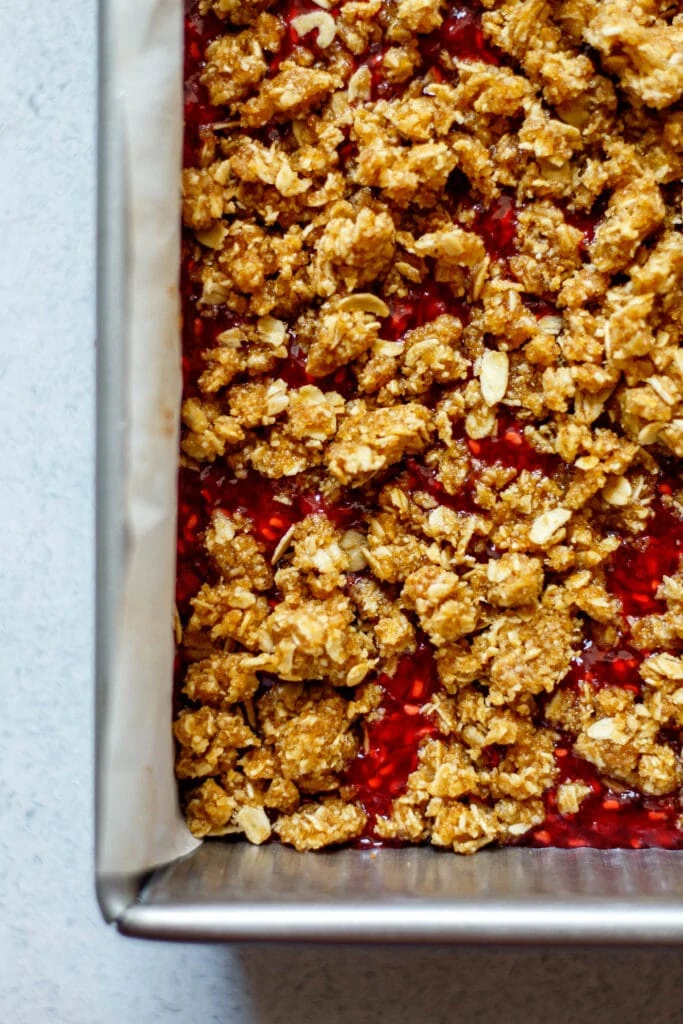 healthy raspberry oatmeal bars before baking in 8x8 pan