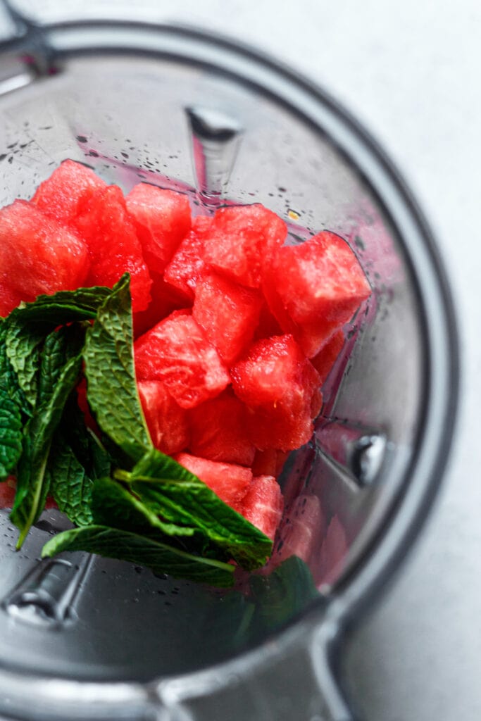 cubed watermelon and mint in a blender