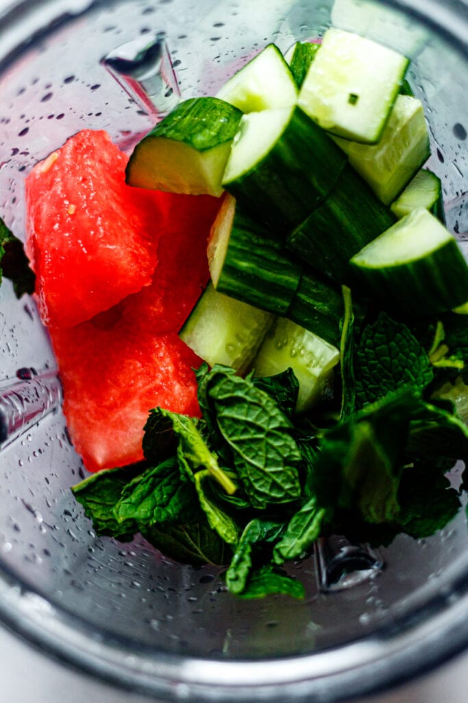 watermelon, cucumber, and mint leaves in a blender