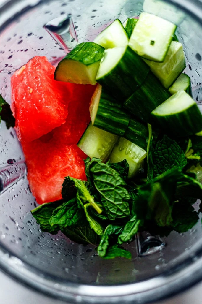 watermelon, cucumber, and mint leaves in a blender