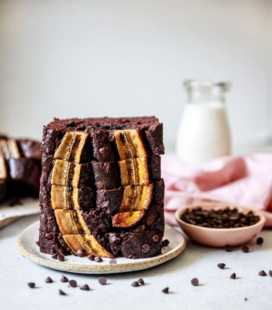 slices of banana bread stacked on a plate