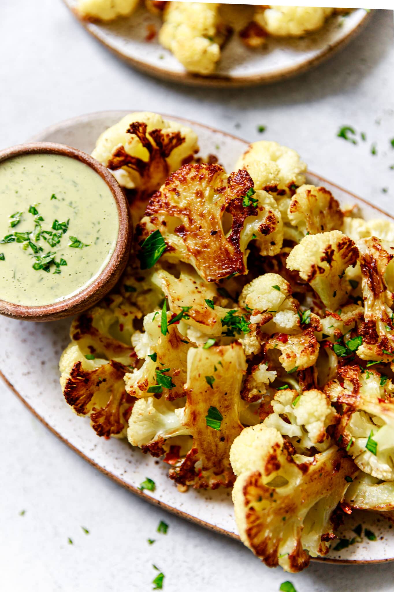 Oven Roasted Cauliflower with Tahini Sauce - All the Healthy Things