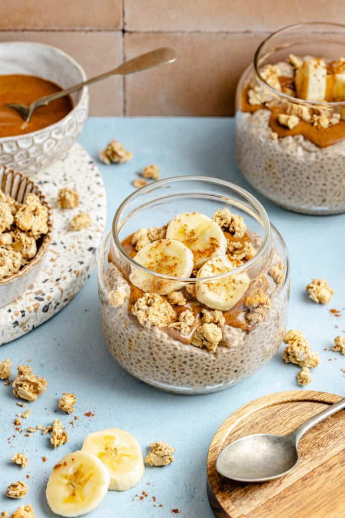 banana chia pudding in glass jar with toppings
