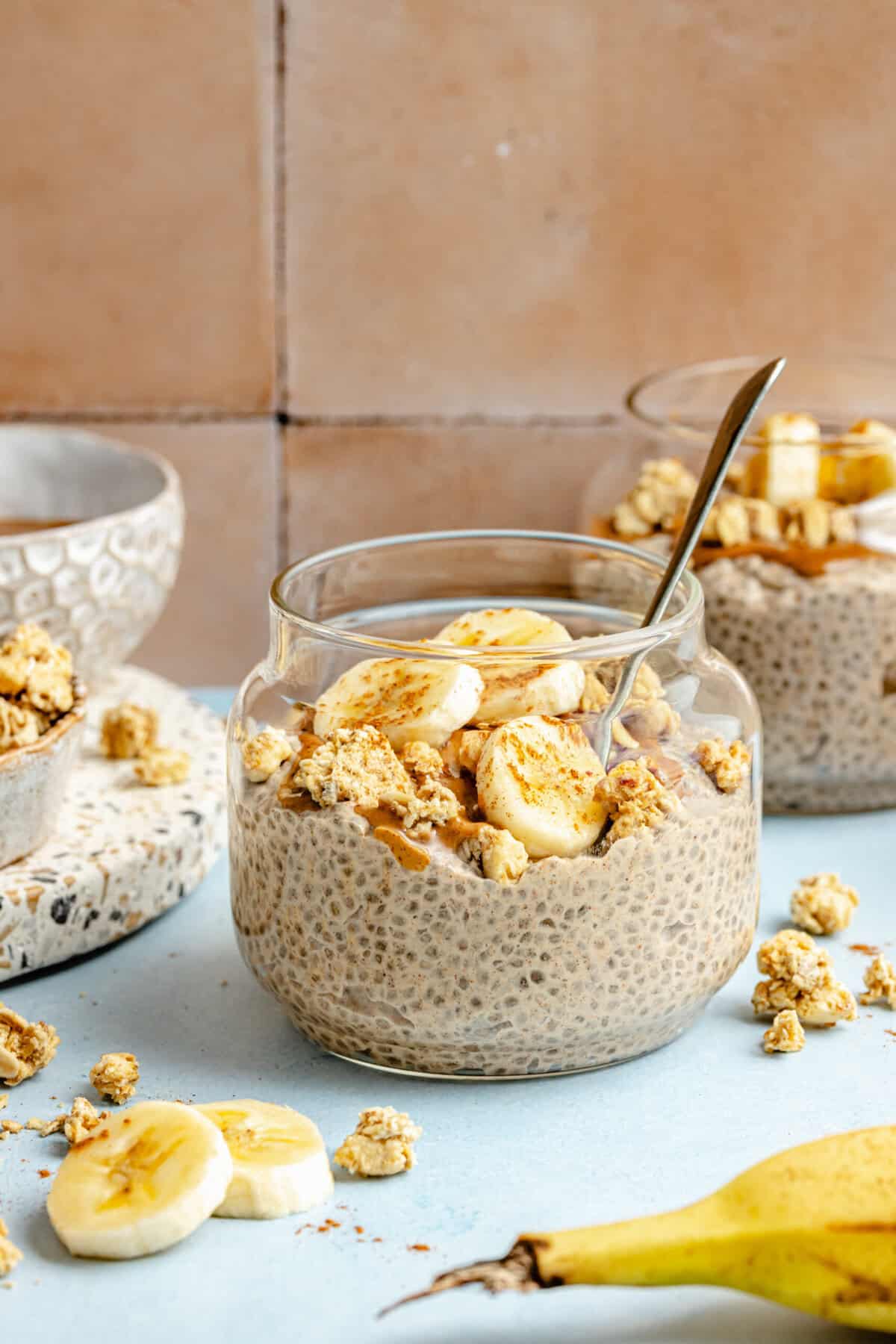banana chia pudding in glass jar with spoon