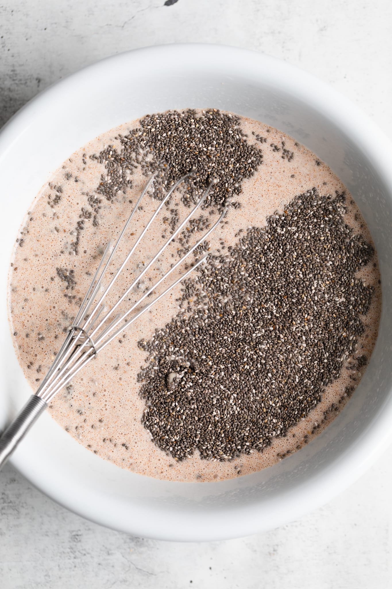 chia seeds and whisk in bowl