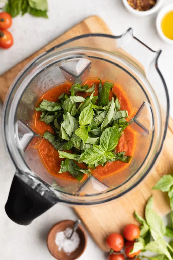 tomato soup in blender with basil