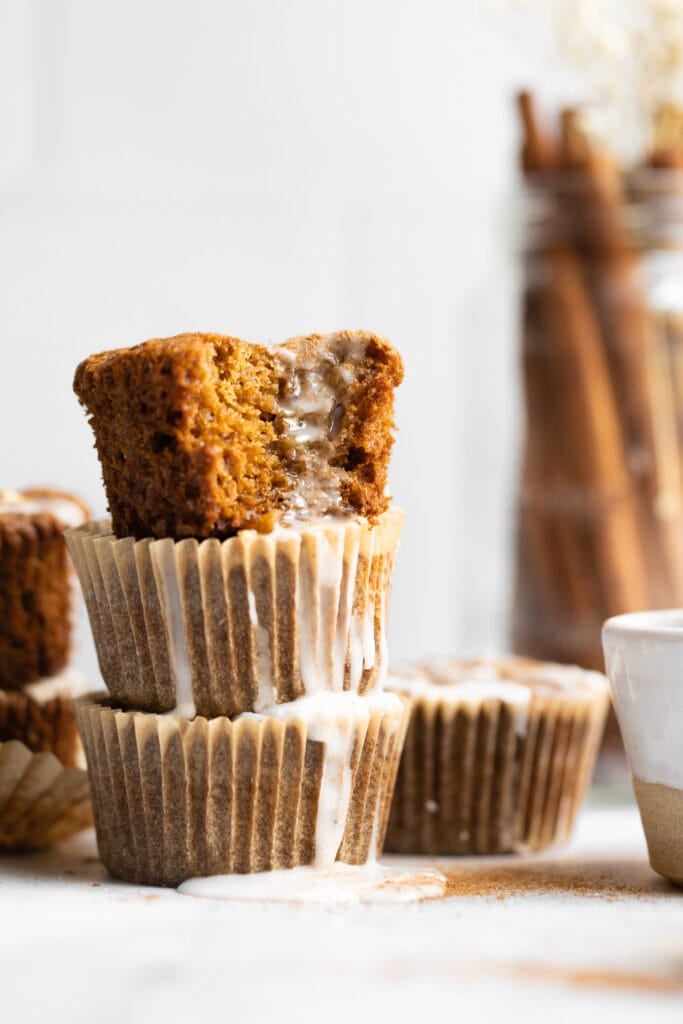apple cinnamon muffins stacked with icing