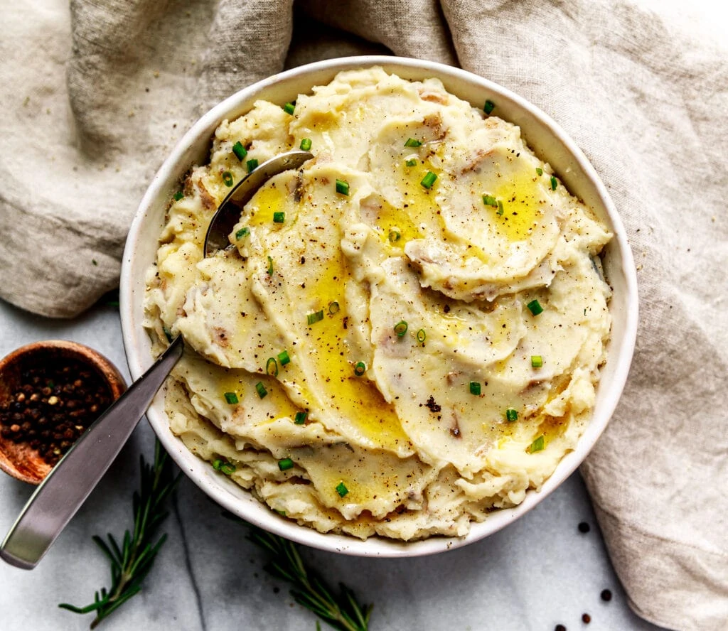 mashed potatoes in white bowl with spoon