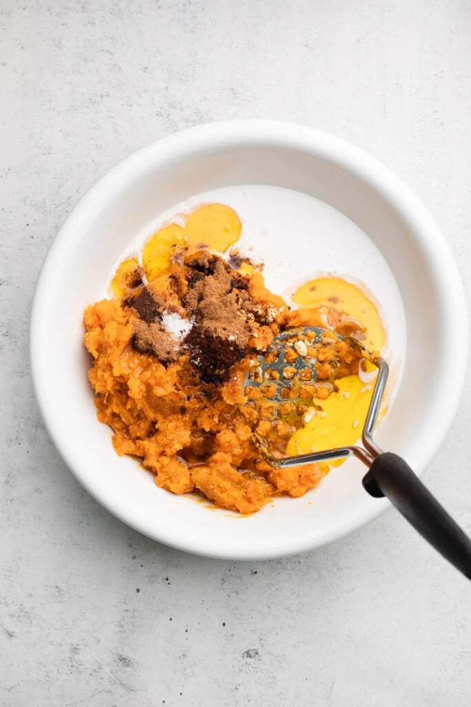 ingredients in bowl with masher