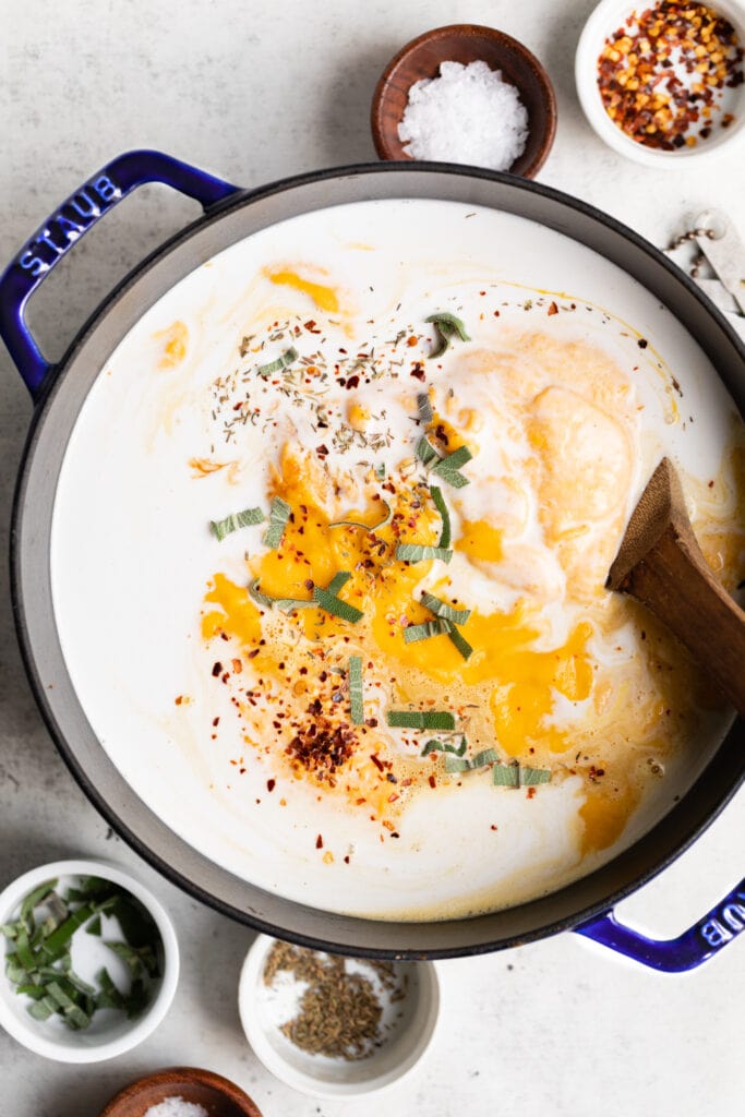 blended squash, coconut milk, and herbs in pot