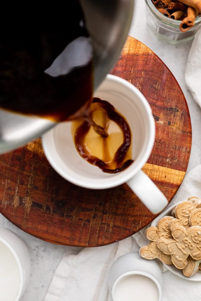 coffee being poured into cup