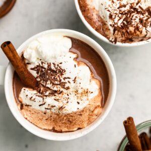 hot chocolate with whipped cream and chocolate shavings