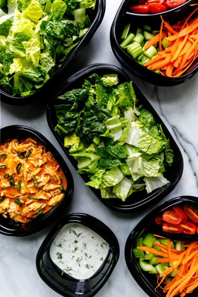 salad components in meal prep containers