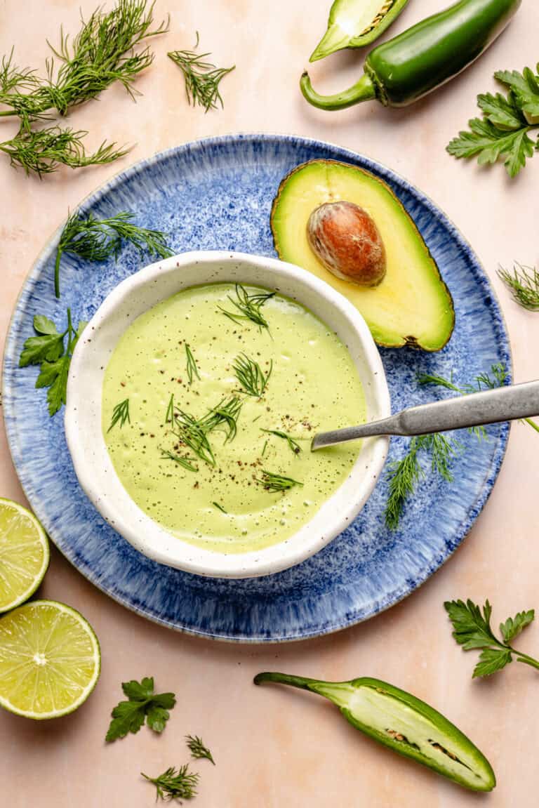 jalapeno ranch dressing in serving dish with spoon on plate