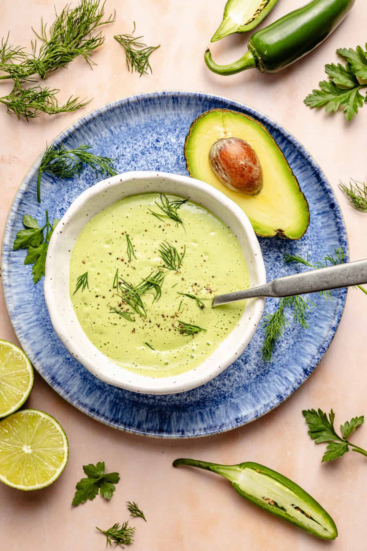 jalapeno ranch dressing in serving dish with spoon on plate