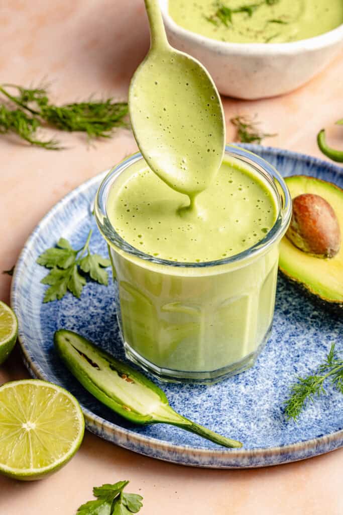 jalapeno ranch in glass storage container with spoon