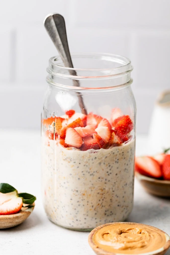 oats in a mason jar with strawberries