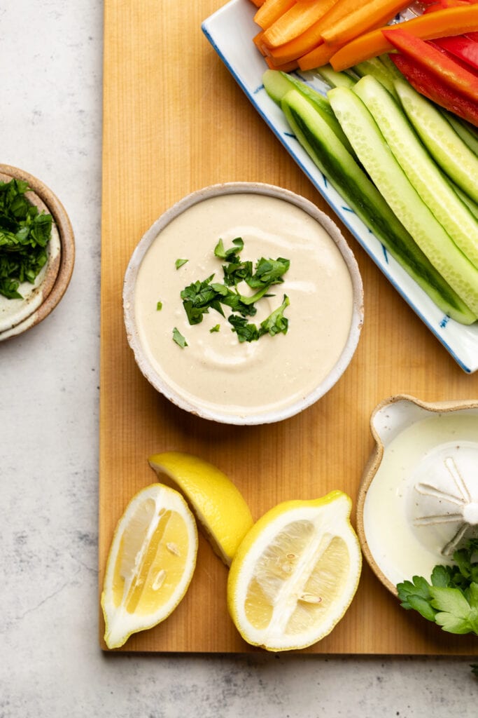 tahini sauce topped with parsley