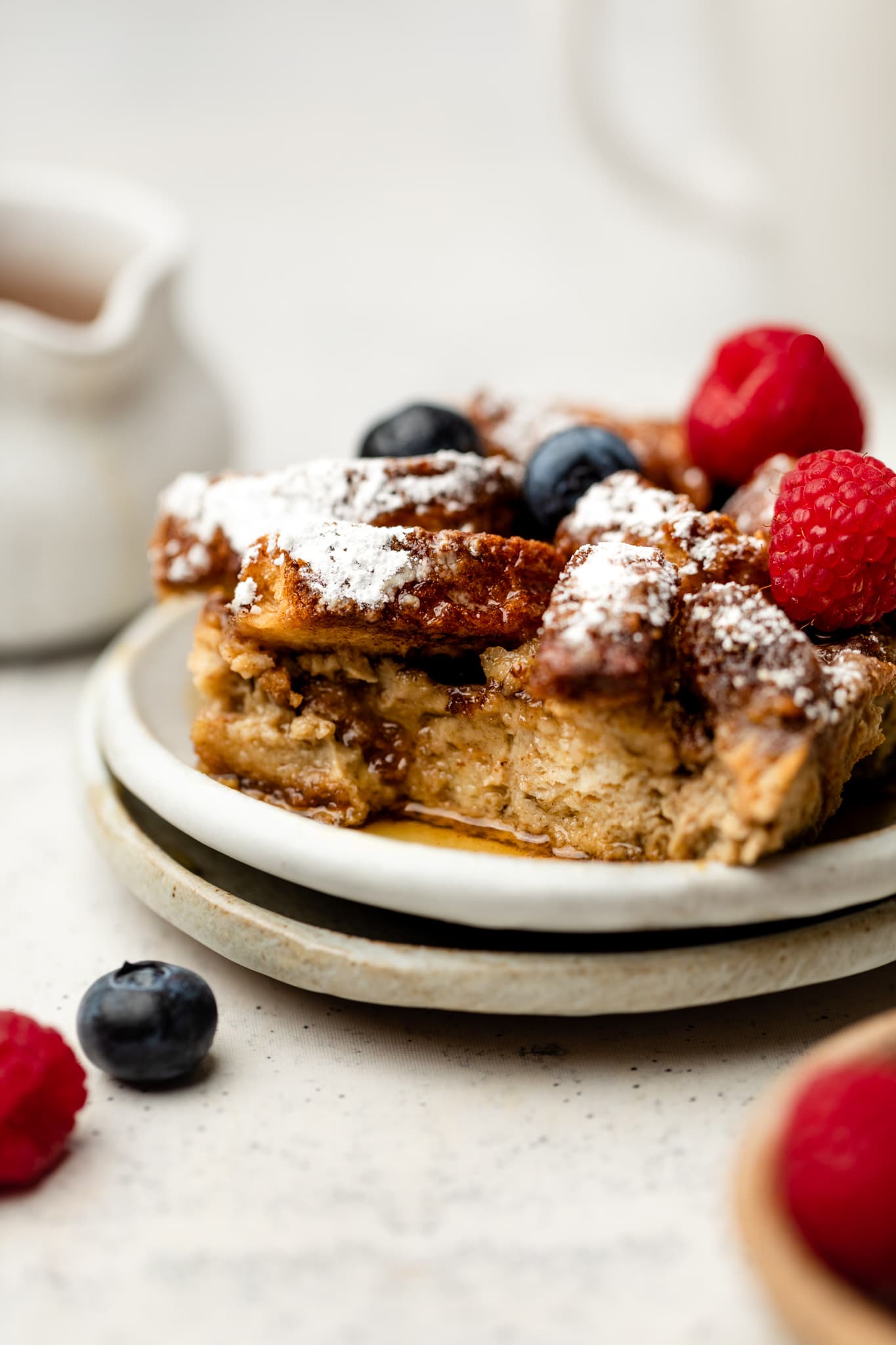 slice of French toast casserole with berries on top