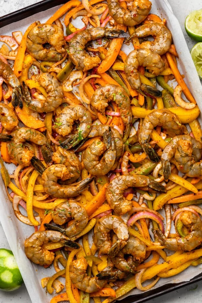 raw shrimp and veggies on sheet pan