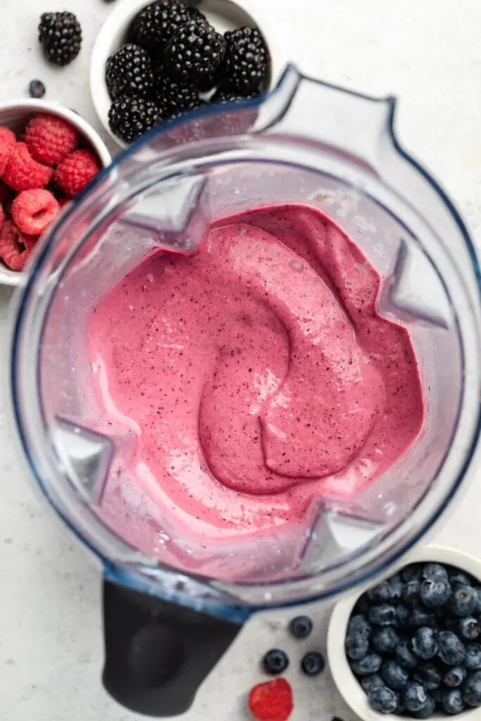 mixed berry smoothie ingredients in blender