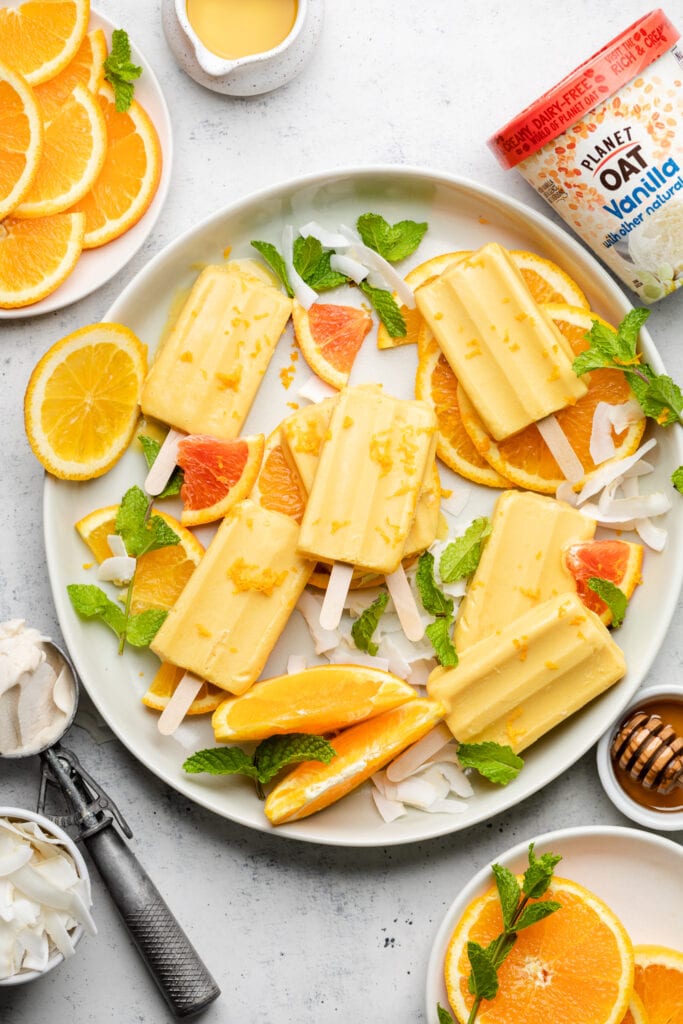 orange popsicles on a platter
