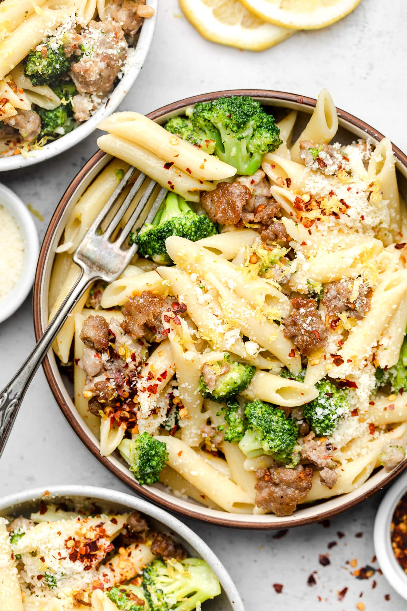 sausage and broccoli pasta in large bowl