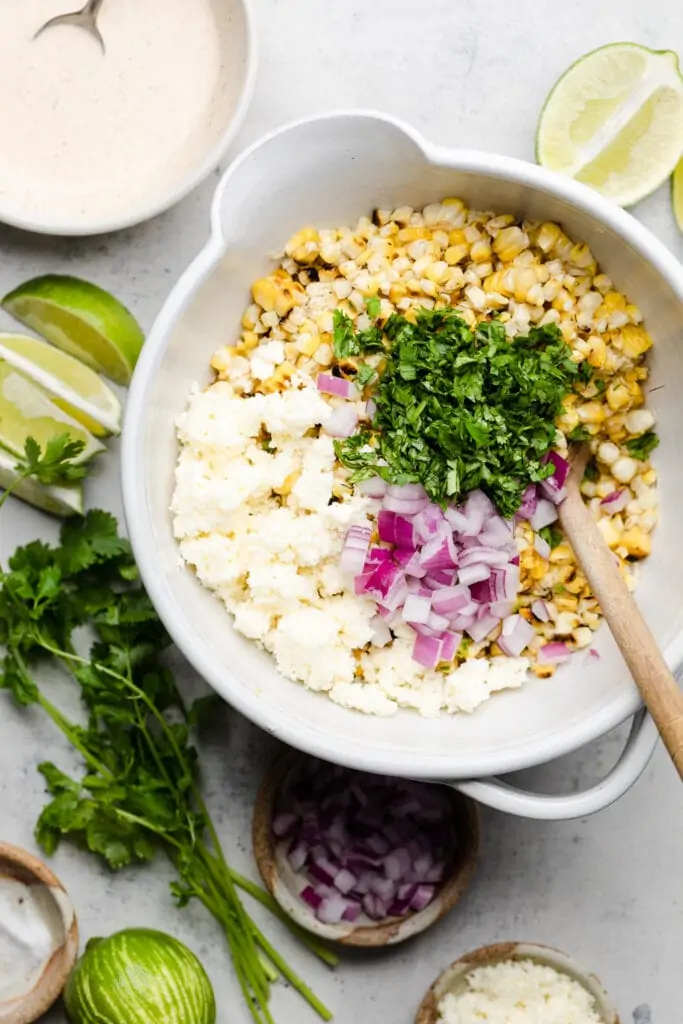 street corn salad ingredients in a bowl