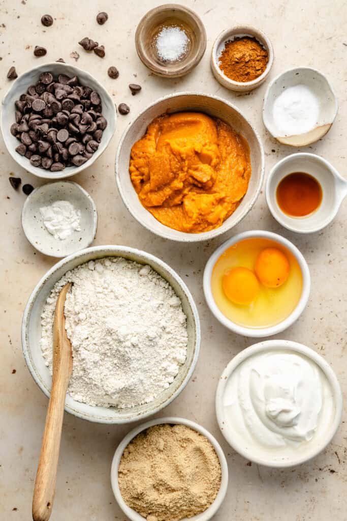 pumpkin chocolate chip muffin ingredients in small bowls