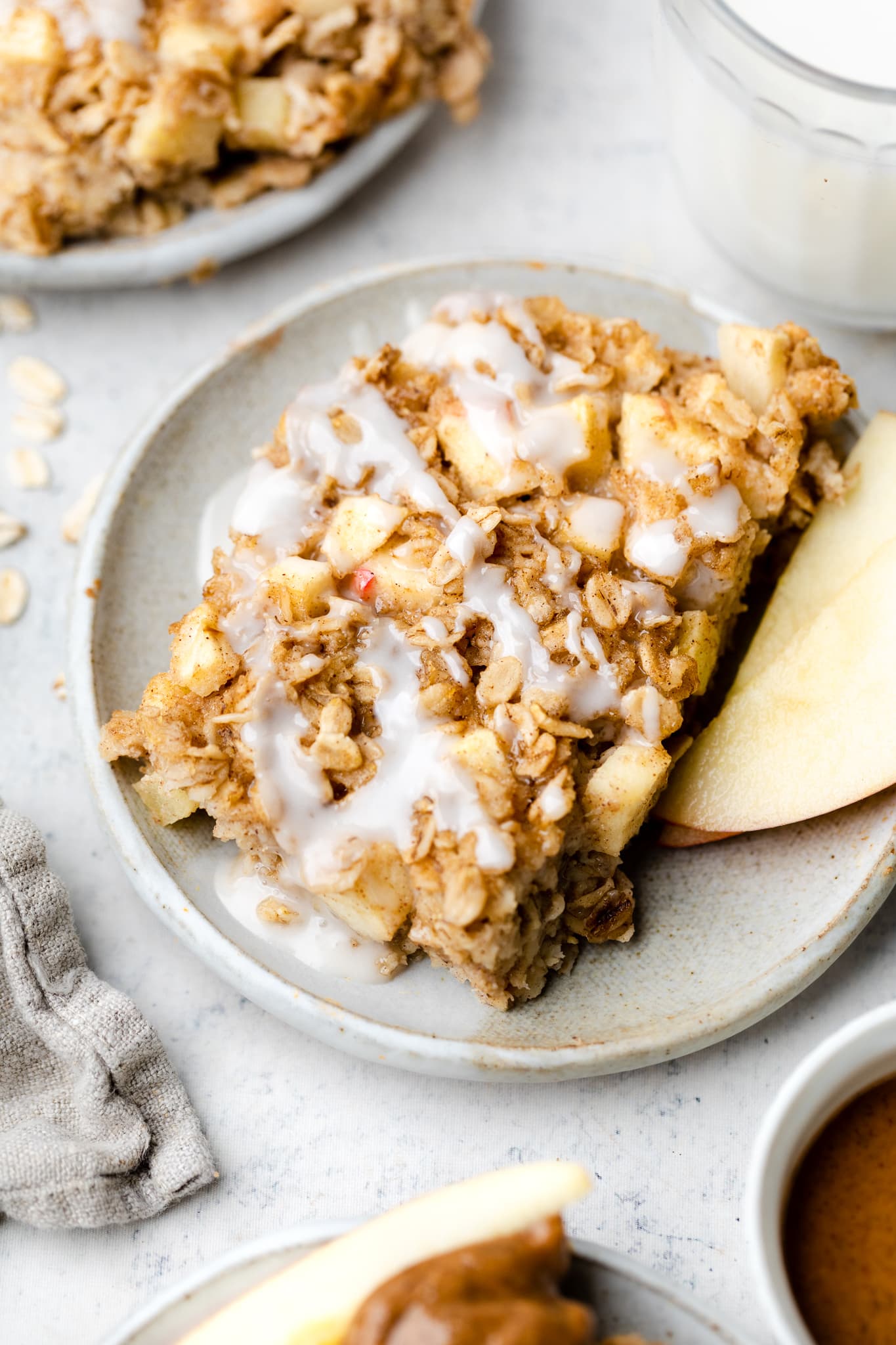baked oatmeal on page with icing drizzle